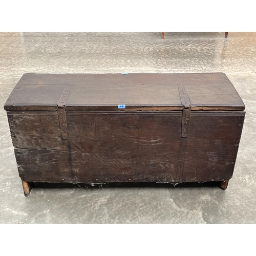 416 - A late 17th century oak six plank chest, with chip carved decoration, the channel moulded lid enclos... 