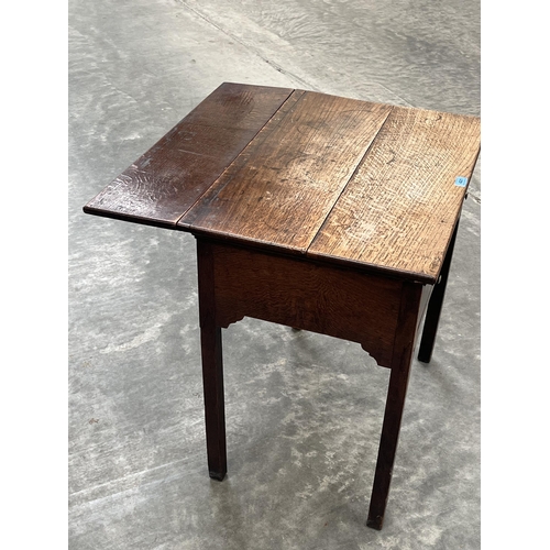 421 - A George III joined oak dropleaf side table with frieze drawer on square legs. 27' wide