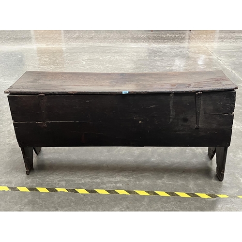 422 - A 17th century oak six plank chest with moulded chip carved front, the plain side descending to V cu... 