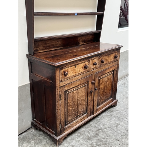 481 - An 18th century dresser, the raised rack with three shelves, the base with three crossbanded and lin... 