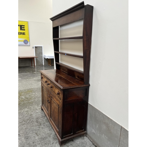 481 - An 18th century dresser, the raised rack with three shelves, the base with three crossbanded and lin... 