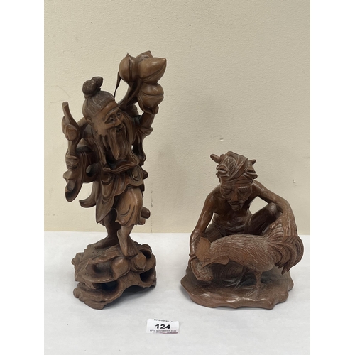 124 - Two oriental carved treen figures, man with cockeral and a sage. The sage 12' high