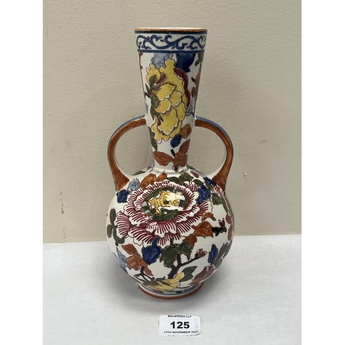 125 - A Gien two handled globular vase with tapered neck, painted with foliage. 10¼' high. Chip to foot ri... 