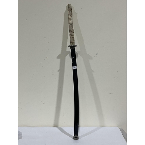 158 - A decorative Samurai style sword with dragon moulded resinous handle. 46' long