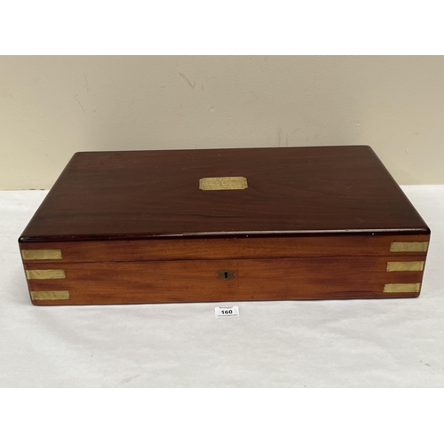 160 - A Victorian mahogany and brass mounted box with velvet lined interior. 25' wide