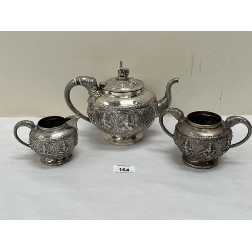 164 - An early 20th century Burmese 800 silver tea service, comprising teapot, sucrier and milk jug, with ... 