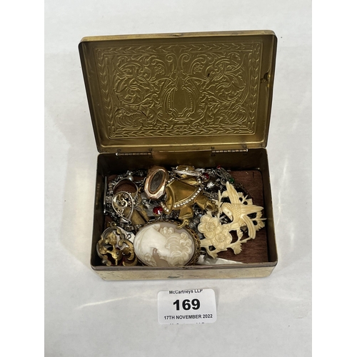 169 - A brass box of sundry jewellery