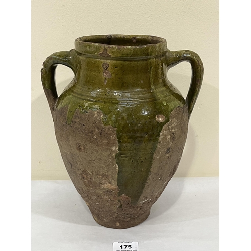 175 - A Tudor green ware two handled jar, part glazed on a buff pottery fabric. Surrey, Hampshire borders ... 