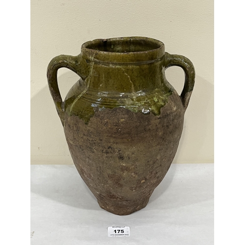 175 - A Tudor green ware two handled jar, part glazed on a buff pottery fabric. Surrey, Hampshire borders ... 