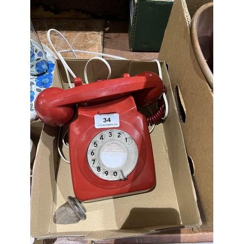 34 - A vintage red telephone