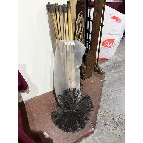 6 - A bag of chimney sweep's rods with brush and carpet beater