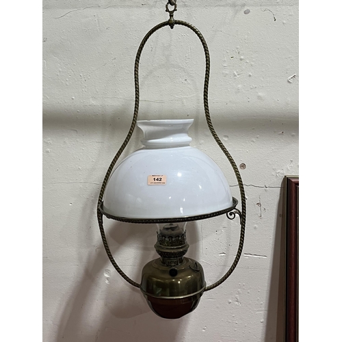 142 - An early 20th century brass hanging oillamp. 26' high