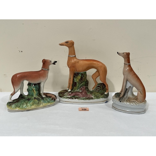 144 - Three 19th century Staffordshire whippet figures, the largest 9¾' high