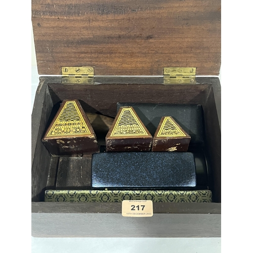 217 - A 19th century mahogany box with sundry contents