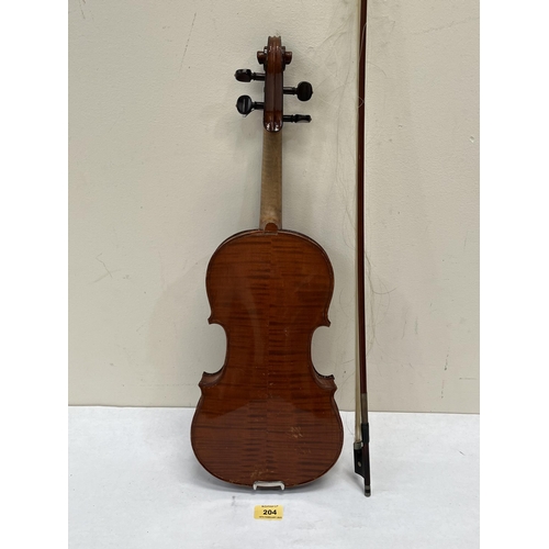 204 - A violin with bow. Length of back 14'. Leather cased