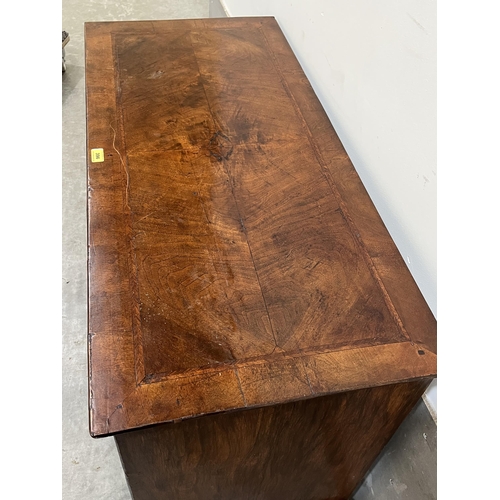 396 - A walnut and herringbone banded chest, the quarter veneered top over two short and two long drawers,... 