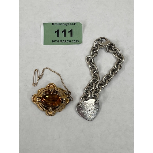 111 - A Victorian citrine filigree brooch and a Tiffany & Co silver heart and chain link bracelet