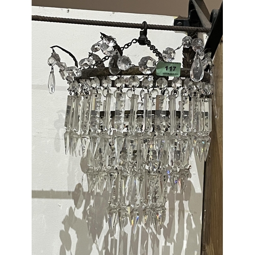 117 - A three tier chandelier hung with cut glass beads and prismatic pendant drops. 13' high