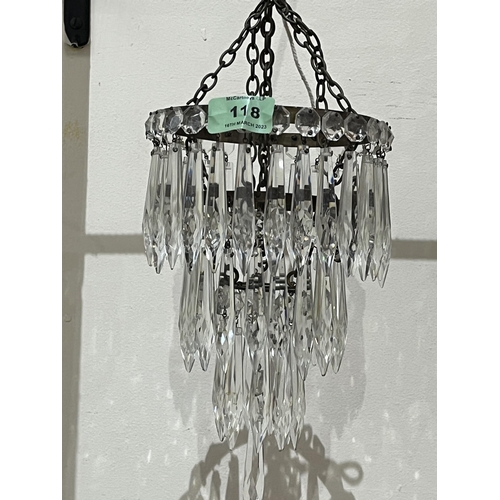 118 - A three tier chandelier hung with cut glass beads and prismatic pendant drops. 9½' high