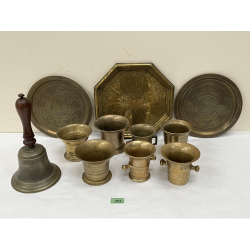 203 - A collection of 18th and 19th century bronze and brass mortars, trays and handbell