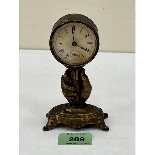 209 - A small American gilt metal timepiece by the Waterbury Clock Co. 5' high. Late 19th century