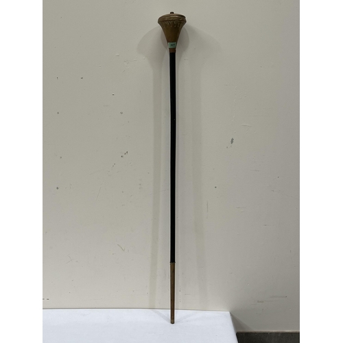 221 - A leather bound parade staff with brass pommel. 52' long