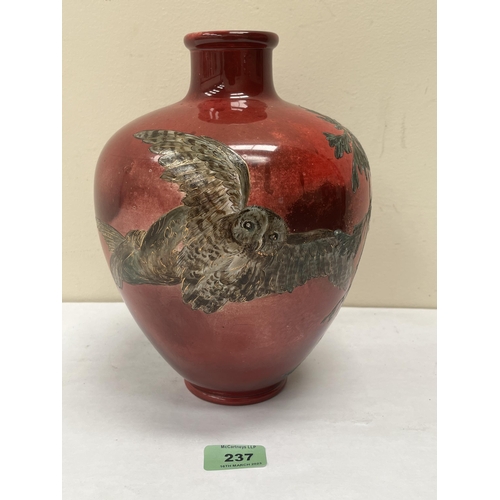 237 - A Bretby oviform vase, decorated with two owls, trees and moon on a mottled red glaze. 9¾' high