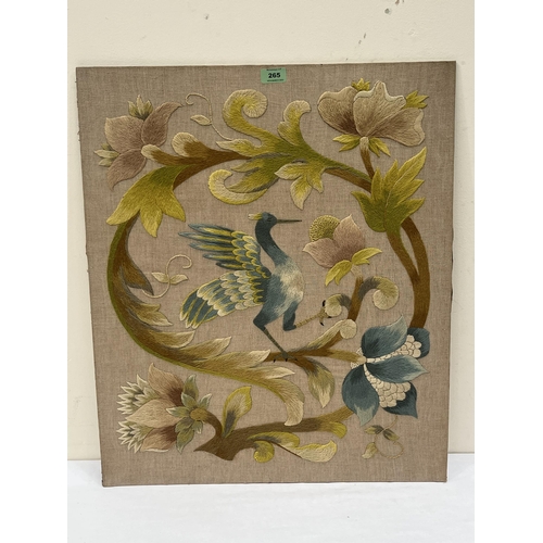 265 - An Art-Nouveau embroidery of bird and foliage. 26½' x 22½'. Unframed.