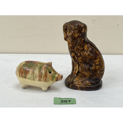 267 - Two pottery animalier moneybanks, the spaniel. 5' high