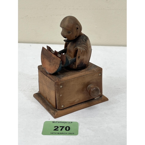 270 - A Japanese Meiji period boxwood kobe automation toy, modelled as a figure eating a melon, with artic... 