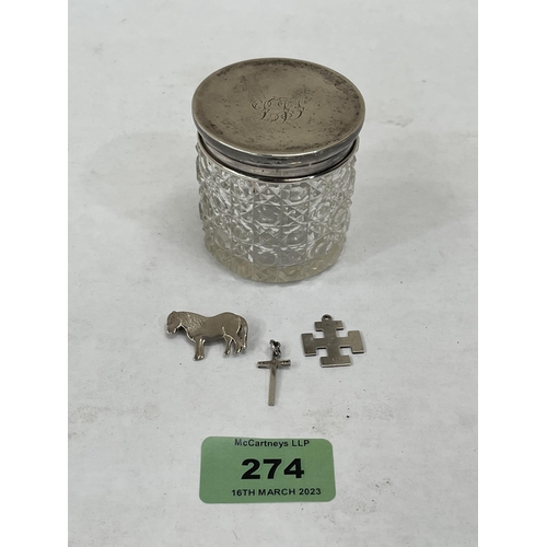 274 - A cut glass silver topped dressing jar with a silver horse brooch and two pendants