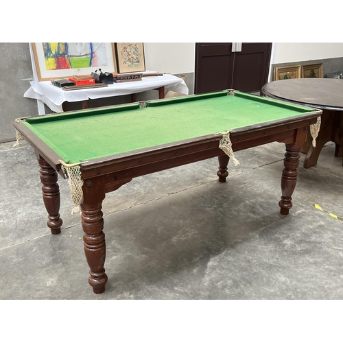 424 - A quarter size E.J. Riley mahogany snooker table with slate bed on turned legs. To include a selecti... 