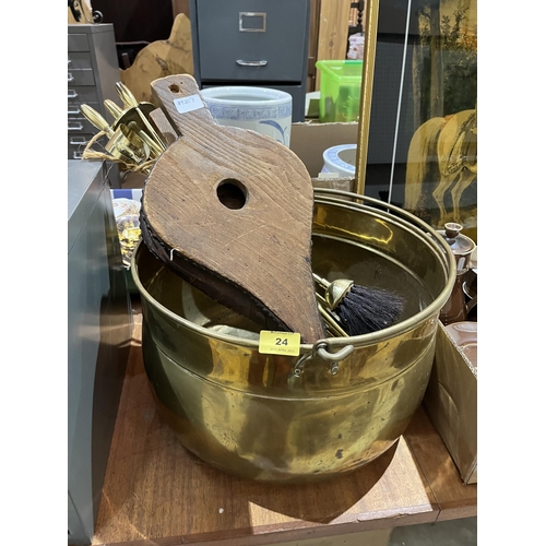 24 - A brass log bin, fireside companion set and fireside bellows