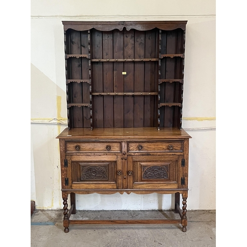 271 - An oak dresser with raised rack. 47' wide