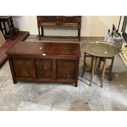 273 - An oak blanket chest and an oak folding table with Benares tray top