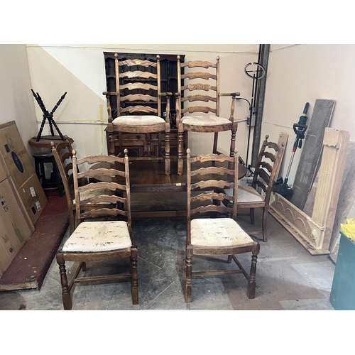 277 - An oak extending dining table with concealed leaf and a set of six oak ladderback chairs