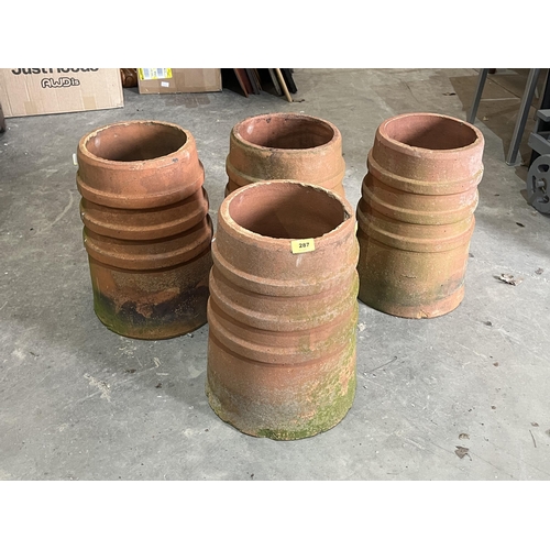 287 - Four terracotta chimney pot planters. 18' high