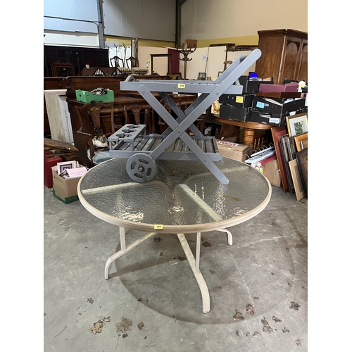 288 - A glass topped garden table and four chairs together with a plant stand