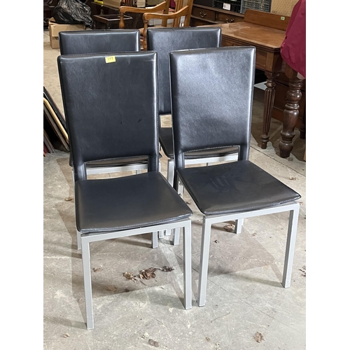 289 - A modernist design glass topped drawleaf table and four chairs