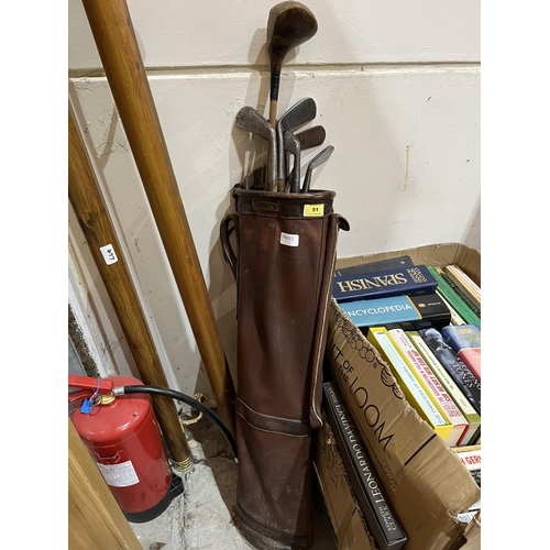 51 - A vintage golf bag with eight hickory shafted clubs