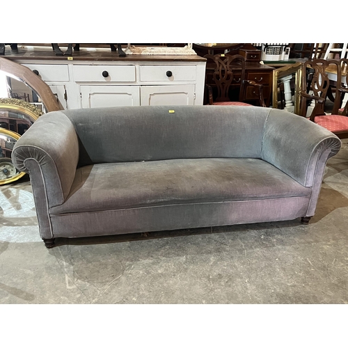 593 - A Victorian Chesterfield sofa on turned forelegs. 74' wide