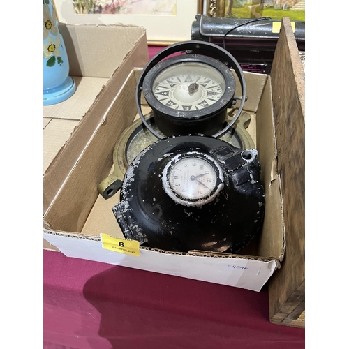 6 - A marine gimbal compass, brass porthole with bullet hole and an aeronautical clock