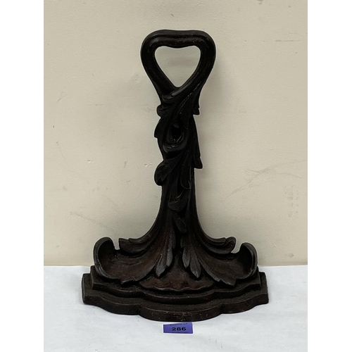 286 - A Victorian cast iron door stop. Stamped 'KENRICK' (Archibald) and numbered 475. 13½' high