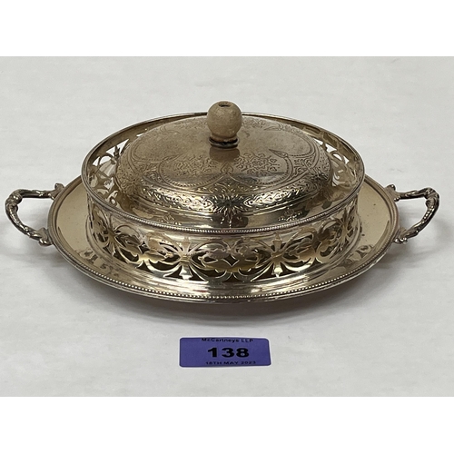 138 - A Victorian silver butter dish with cover and hobnail cut glass liner. London 1880. 8¼' wide over ha... 