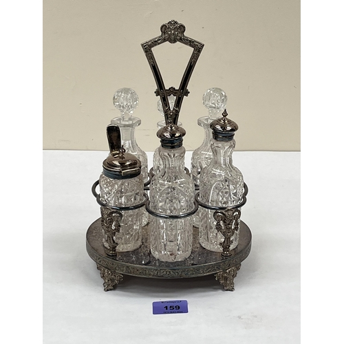 159 - A plated cruet frame with five cut glass bottles and a jar. 11' high