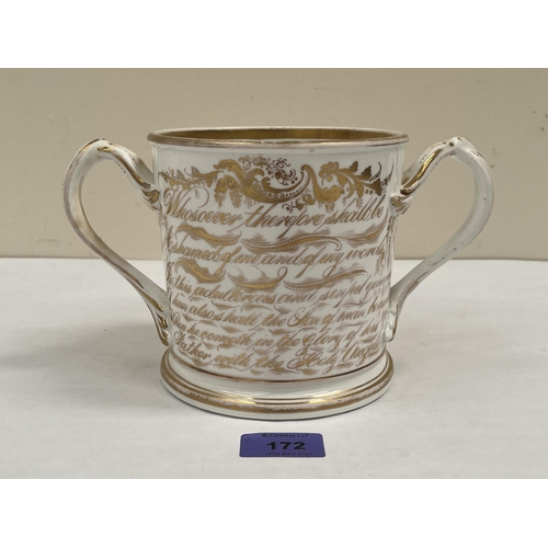 172 - A Victorian Staffordshire loving cup, one side painted with summer flowers, the other in gilt script... 