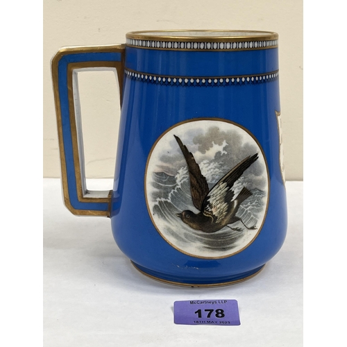 178 - A 19th century Staffordshire mug decorated in two vignettes with birds on a blue ground. Inscribed a... 