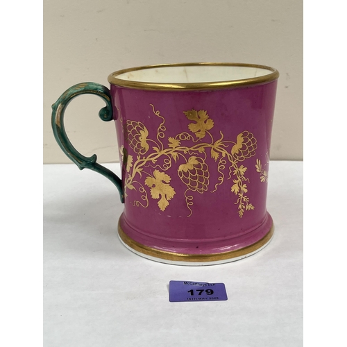 179 - A 19th century Staffordshire mug, gilded with wheatsheaves and initials GB on a rose-pompadour groun... 