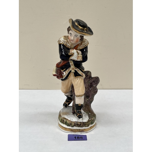 185 - A 19th century Staffordshire figure of a rabbit hunter. 9¼' high