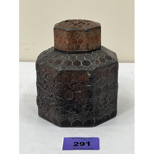 291 - A Chinese octagonal bronzed metal tea caddy and cover, decorated in relief with prunus. 4¼' high